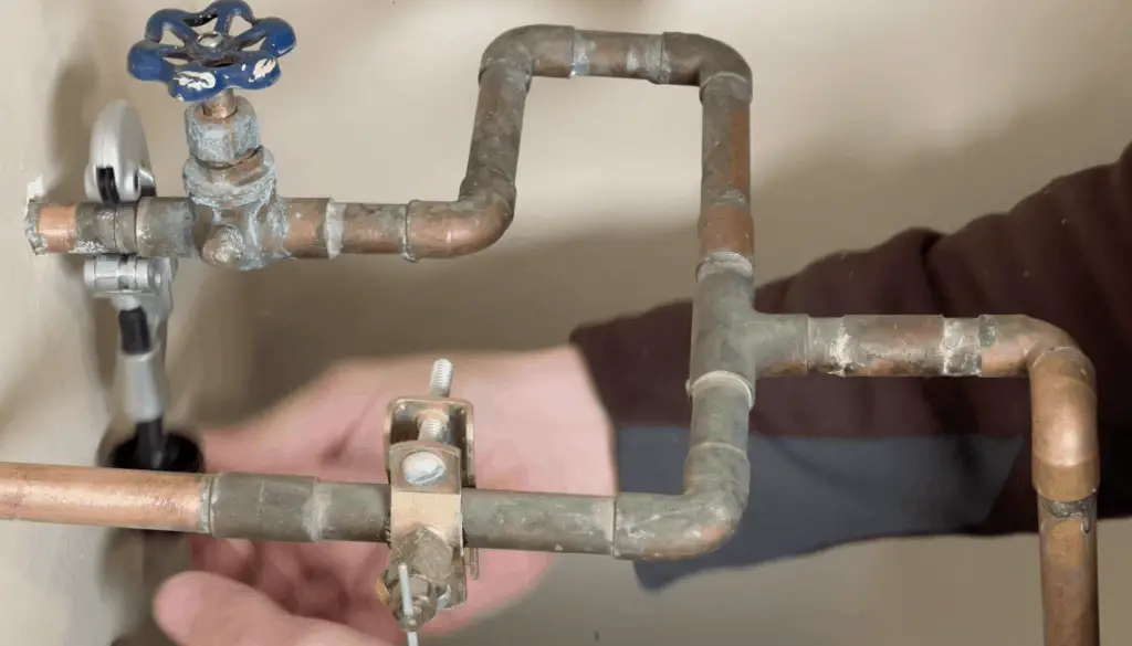 A standard pipe cutter removes old water shut off valve