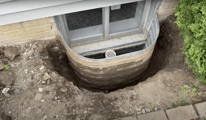 Digging out old window well