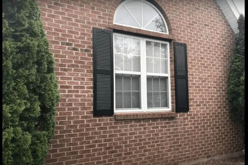Shutters on a brick house
