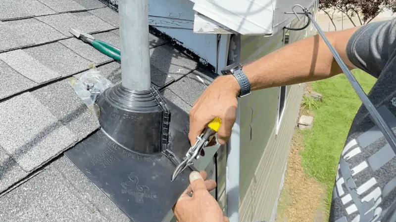 trimming bottom edge of roof boot if necessary