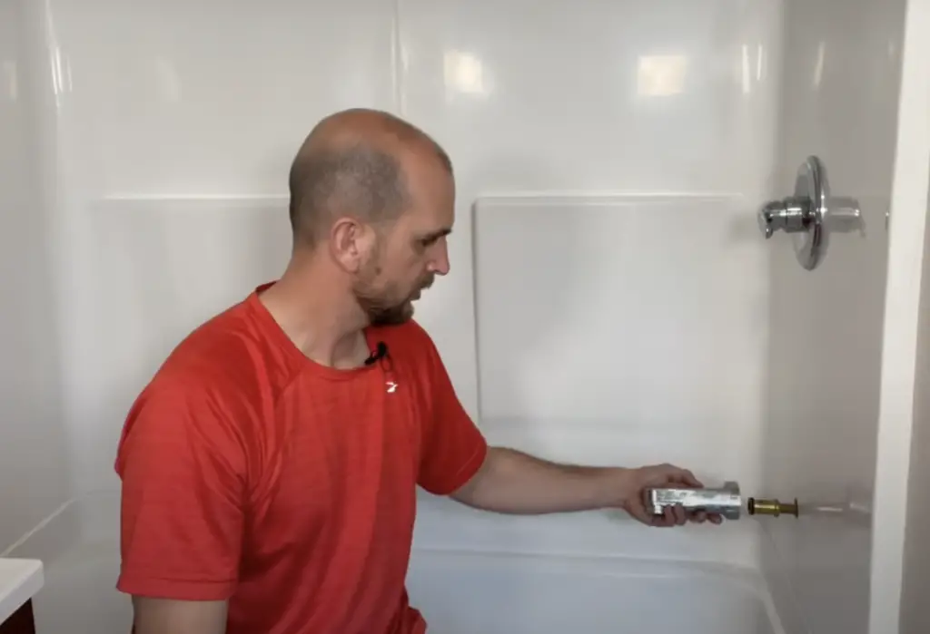 Removing the tub spout by turning it counterclockwise