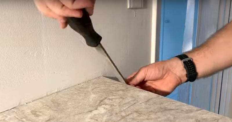 Filing the edge of the top piece of laminate