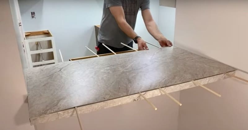 How to Install Sheet Laminate on a Countertop: Coaxing the laminate into its final position