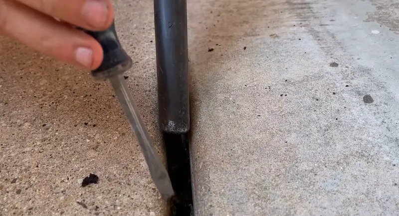 Following along with the shop vac as you scrape up material