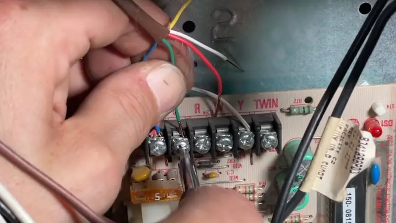 Adding a C-Wire When Installing a Smart Thermostat: Connecting the new run of wire to the control board.