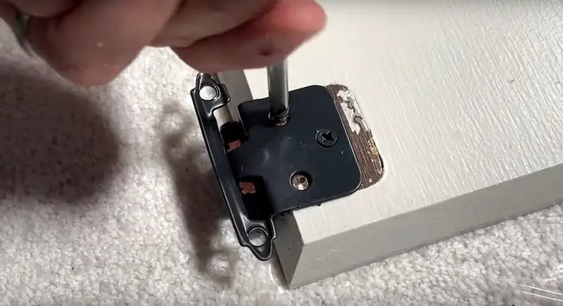 Use a screwdriver to put in the screws
