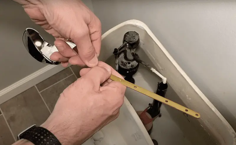 Installing the new toilet handle
