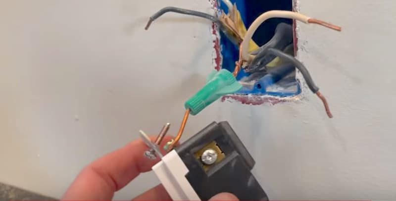 How to Wire a GFCI Outlet: Attaching the ground wire to the receptacle