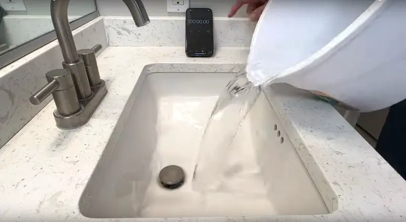 How To Unclog A Bathroom Sink Drain: Baseline test (timing how long it takes for one gallon of water to drain)