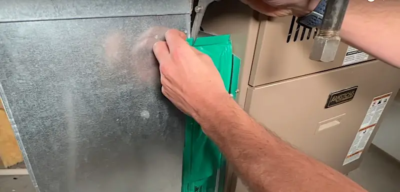 Easy Fix for an Open Furnace Filter Slot: Modifying the top piece of the filter seal by snipping the top magnetic strip