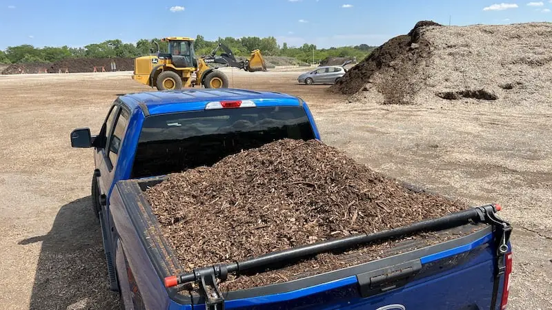 Rear view of 1.5 cubic yards of mulch in the 6.5-foot bed of an F-150