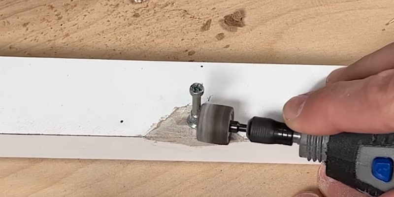 Fix Damaged Ikea Furniture: Sanding the KwikWood with a Dremel tool