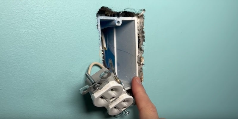 Electrical code limits the amount of material that can be exposed around the box