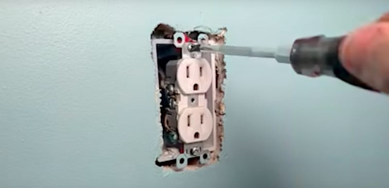 How to Fix a Sunken Outlet: Realigning the outlet with spacers applied and retightening the mounting screws