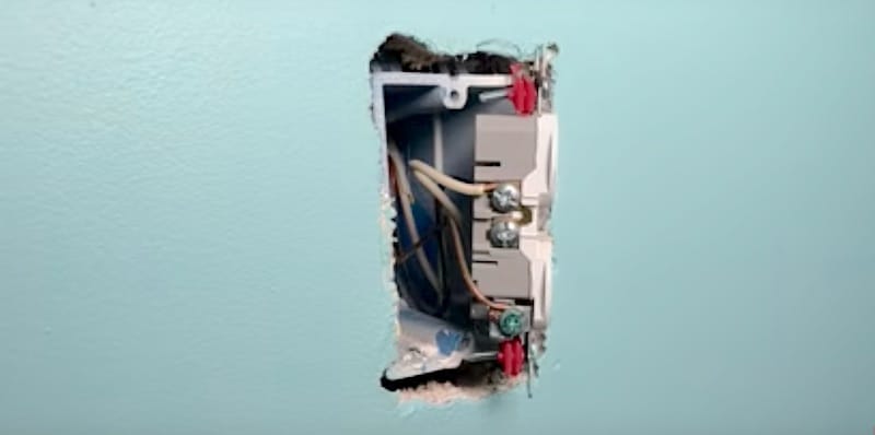 How to Fix a Sunken Outlet: Spacers applied to both mounting screws