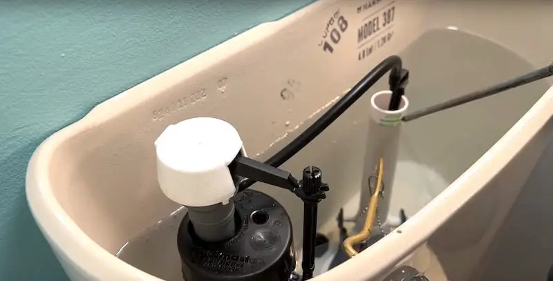 How to Adjust the Water Level in a Toilet: Waterline marked in green on overflow tube