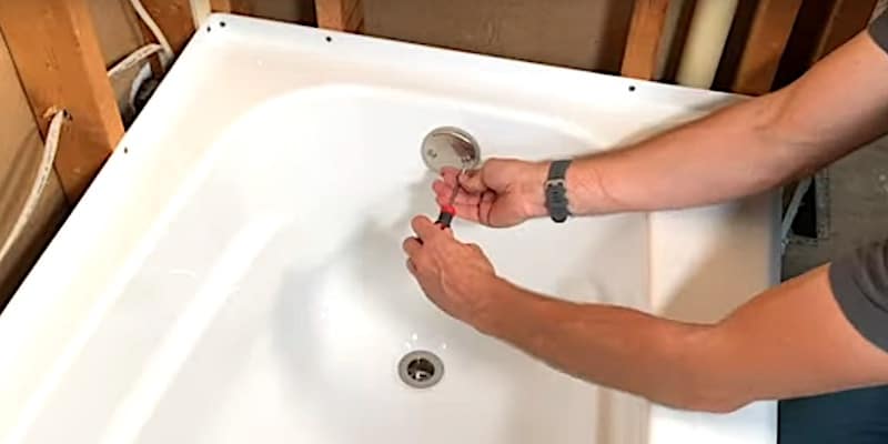 How to Install a Bathtub & Shower Surround: Attaching the drain and overflow hardware