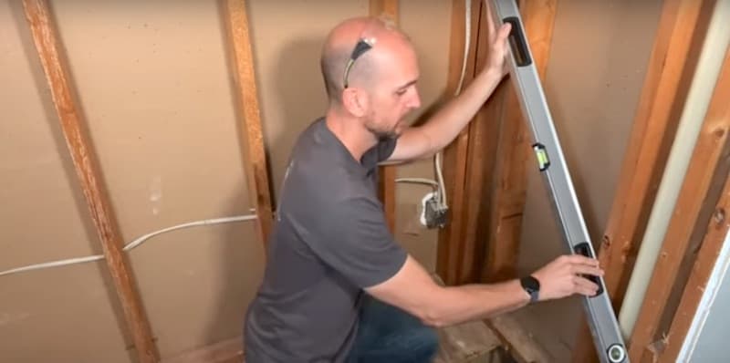 How to Install a Bathtub & Shower Surround: Seeing if the studs are on the same vertical plane