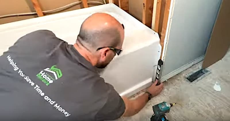 How to Install a Bathtub & Shower Surround: Making sure the front flange is plumb
