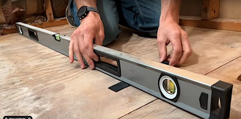 How to Install a Bathtub & Shower Surround: Using a shim to evaluate the slope of the floor