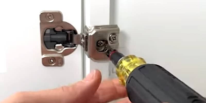 How to Realign Cabinet Doors: Bottom screw adjusts the vertical alignment