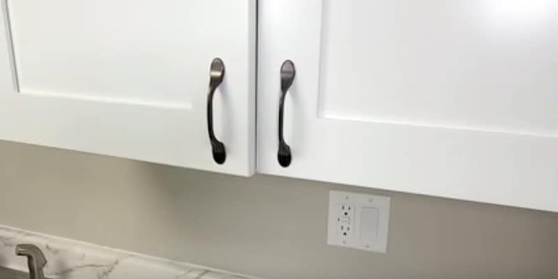 How to Realign Cabinet Doors: Bottom hinge of this cabinet door needs to be shifted to the left