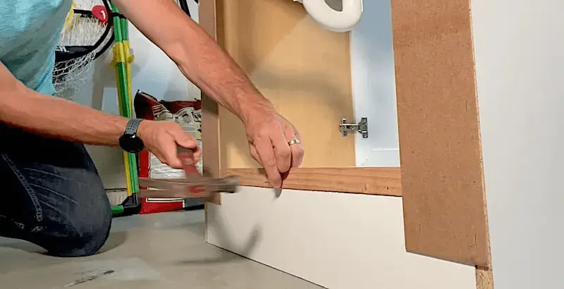 How to Waterproof a Cabinet Base with Flex Seal: Attaching a wood strip to the open back of a vanity