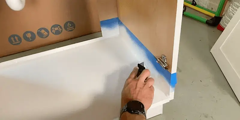 Scoring the bottom edge of the tape before removing