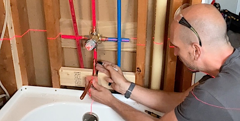 Marking where to cut the PEX to the tub spout