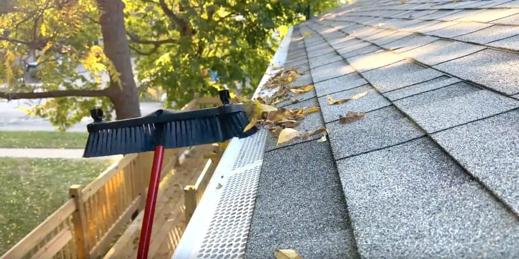 Brushing off gutter guards without getting on a ladder