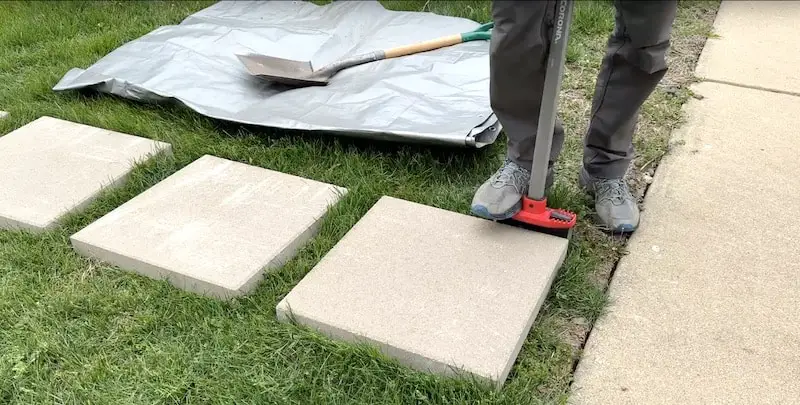 Cutting around the paving stone with an edger