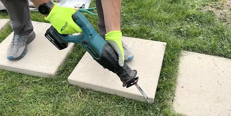 Cutting around the paving stone with a Sawzall