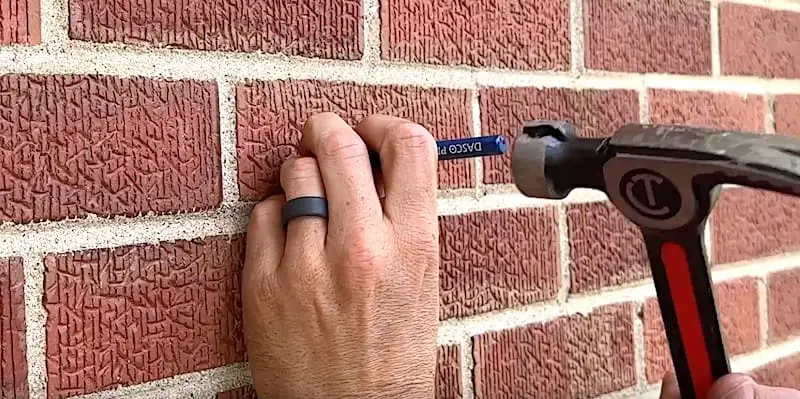 Using a punch to create a pilot hole